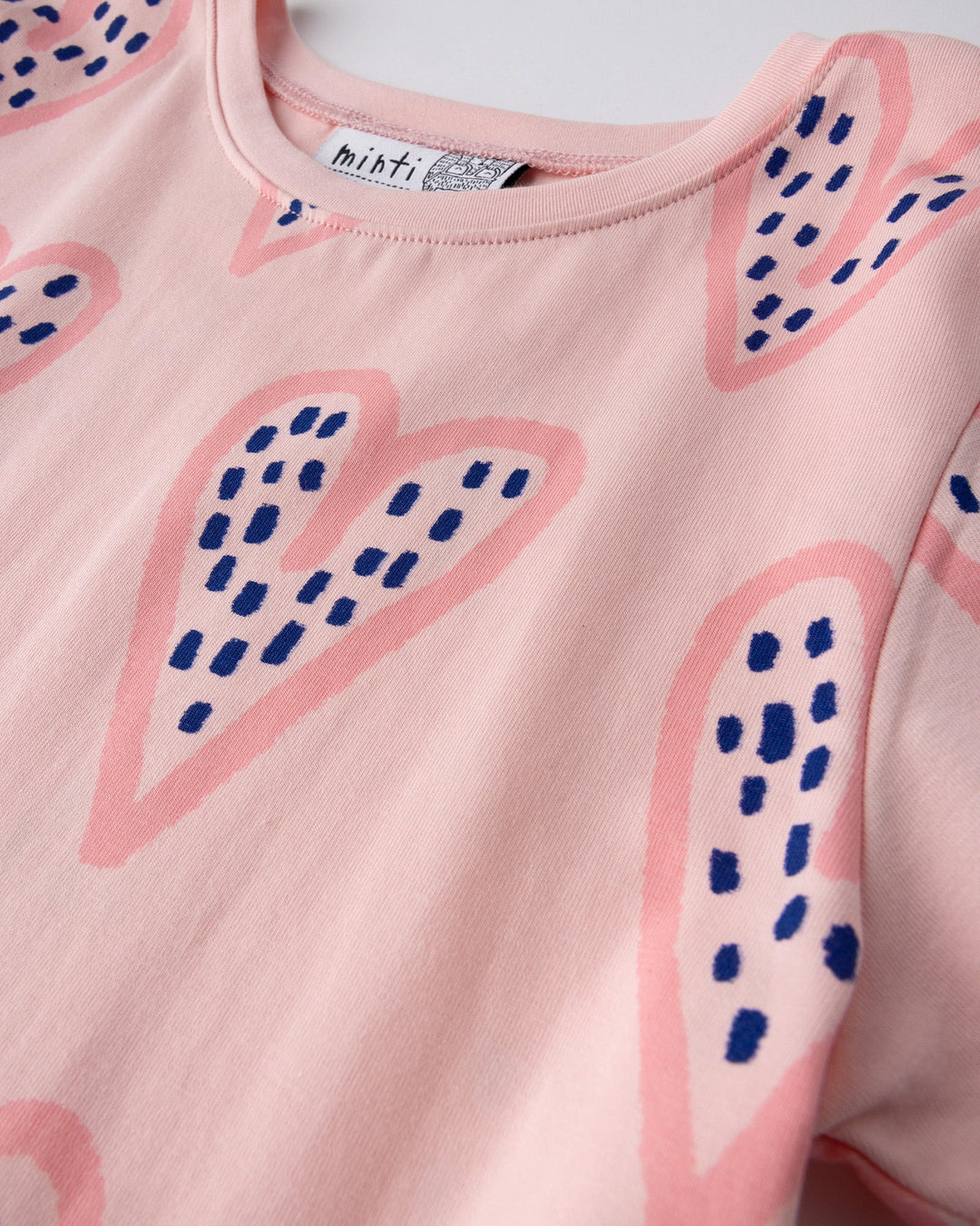 Close up of the Speckle Heart Dress print in pink