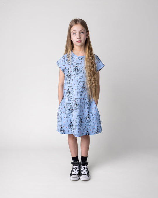 Kid wearing the Bear Hug Dress in blue marle, front view