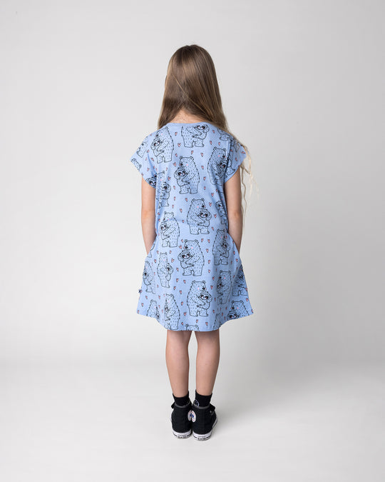 Kid wearing the Bear Hug Dress in blue marle, back view