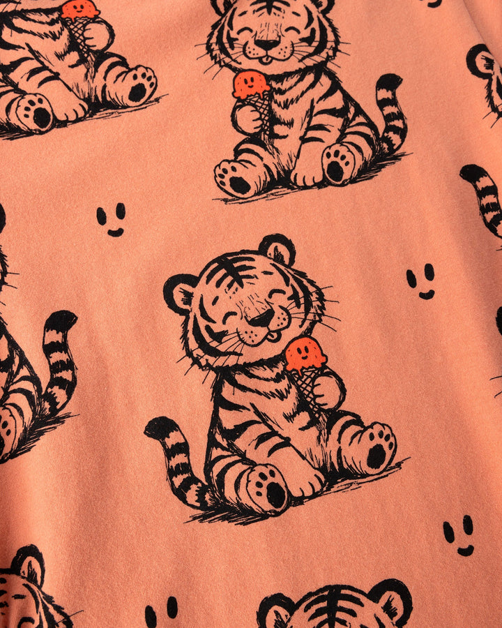 Close up of the Happy Tiger Dress print in apricot