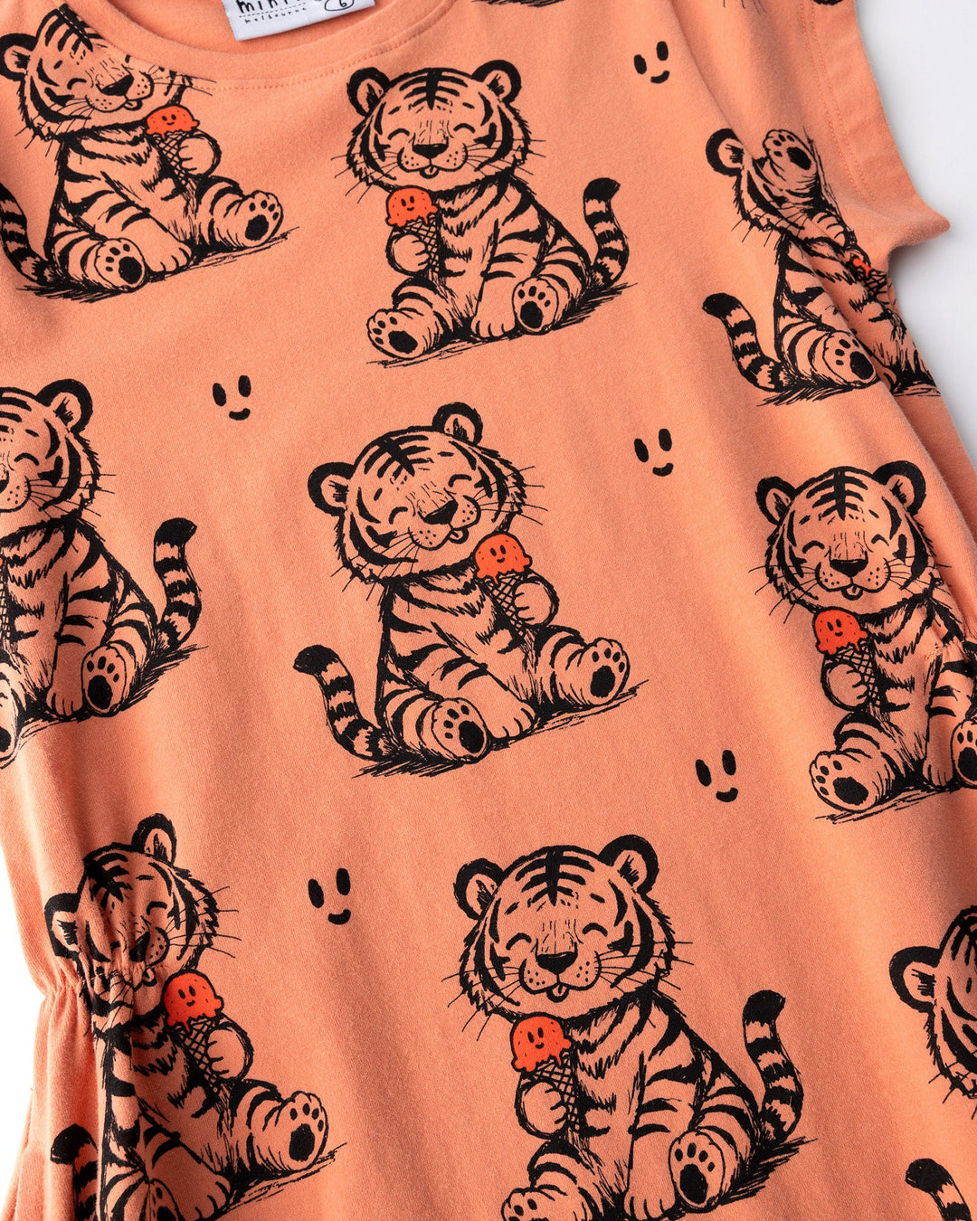 Close up of the Happy Tiger Dress print in apricot