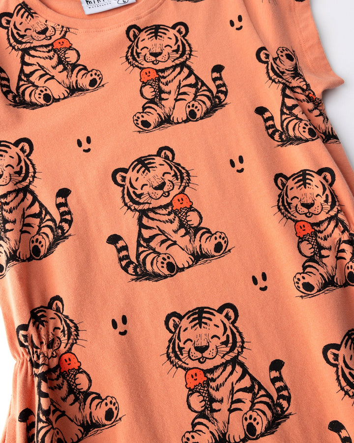 Close up of the Happy Tiger Dress print in apricot
