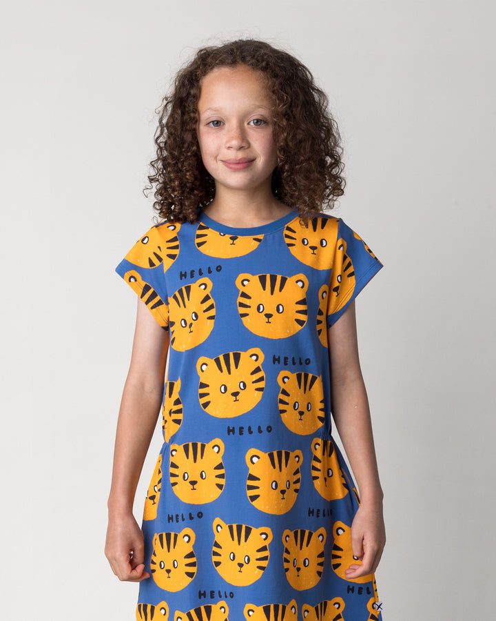 Close up of the Hello Tiger Dress in blue on a kid, front view