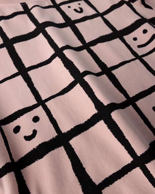 Close up of the Happy Squares Dress print in dusty pink