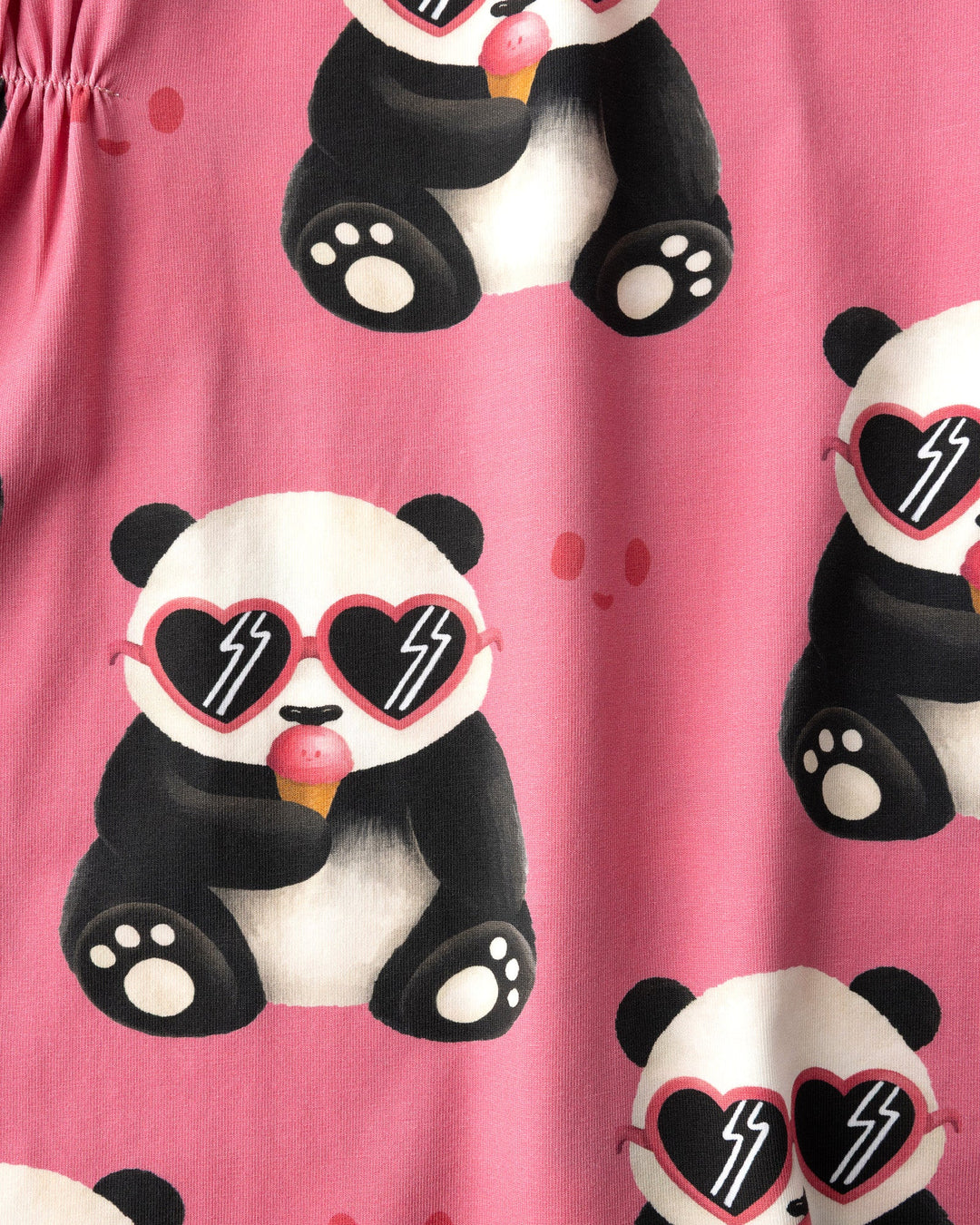 Close up of the Icecream Panda Dress print in candy