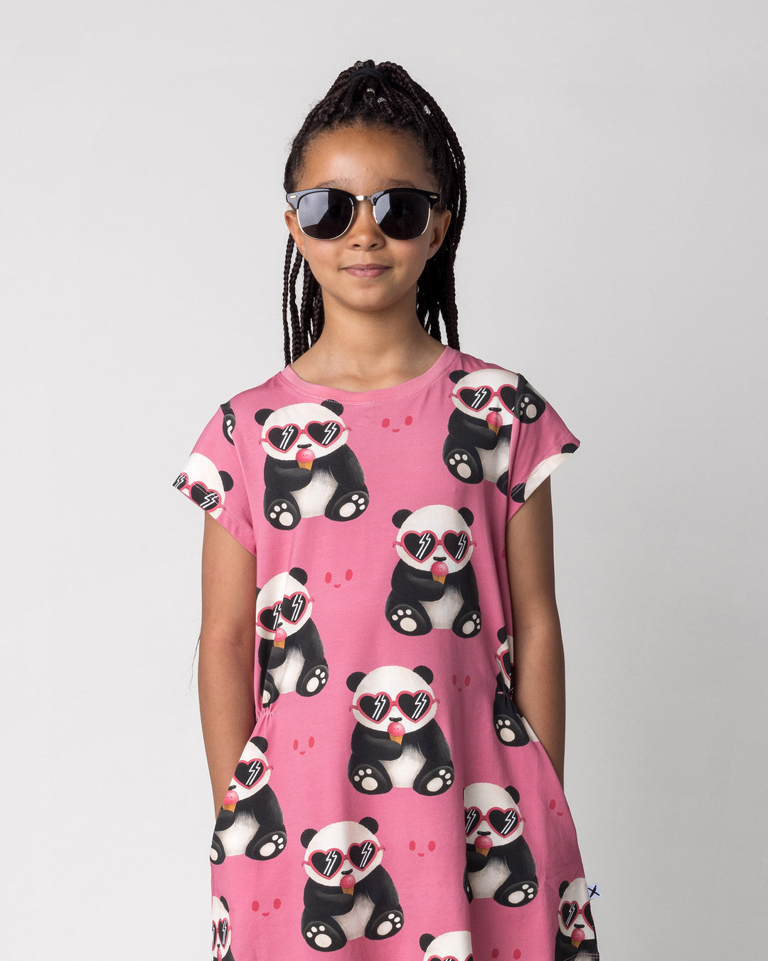 Close up of the Icecream Panda Dress in candy on a kid, front view