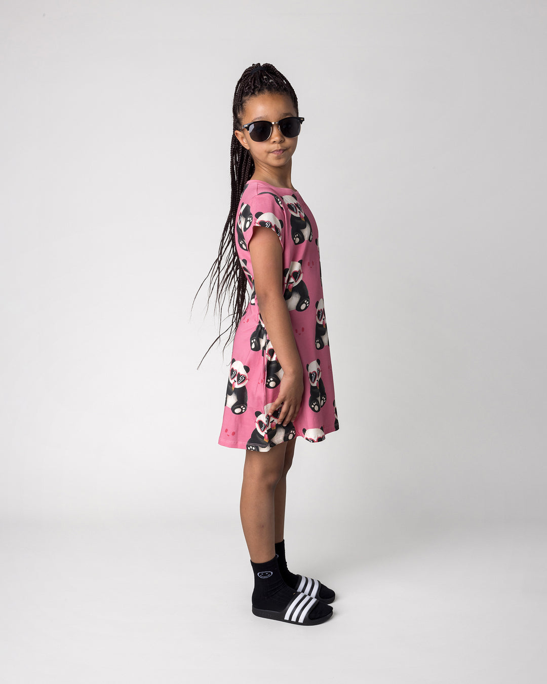 Kid wearing the Icecream Panda Dress in candy, side view