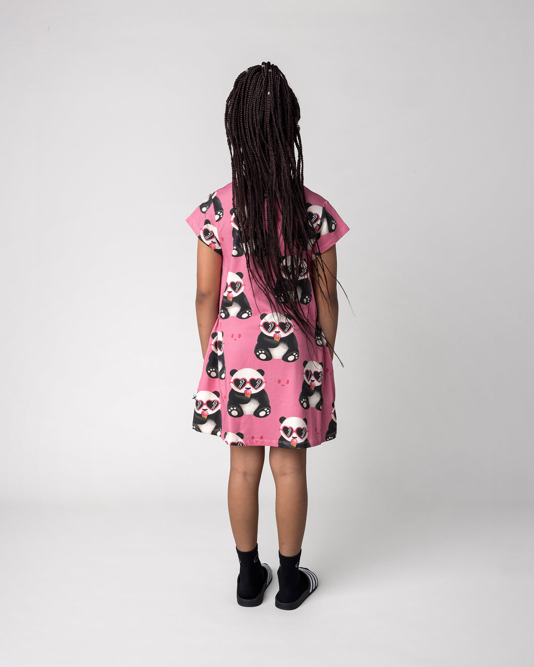 Kid wearing the Icecream Panda Dress in candy, back view