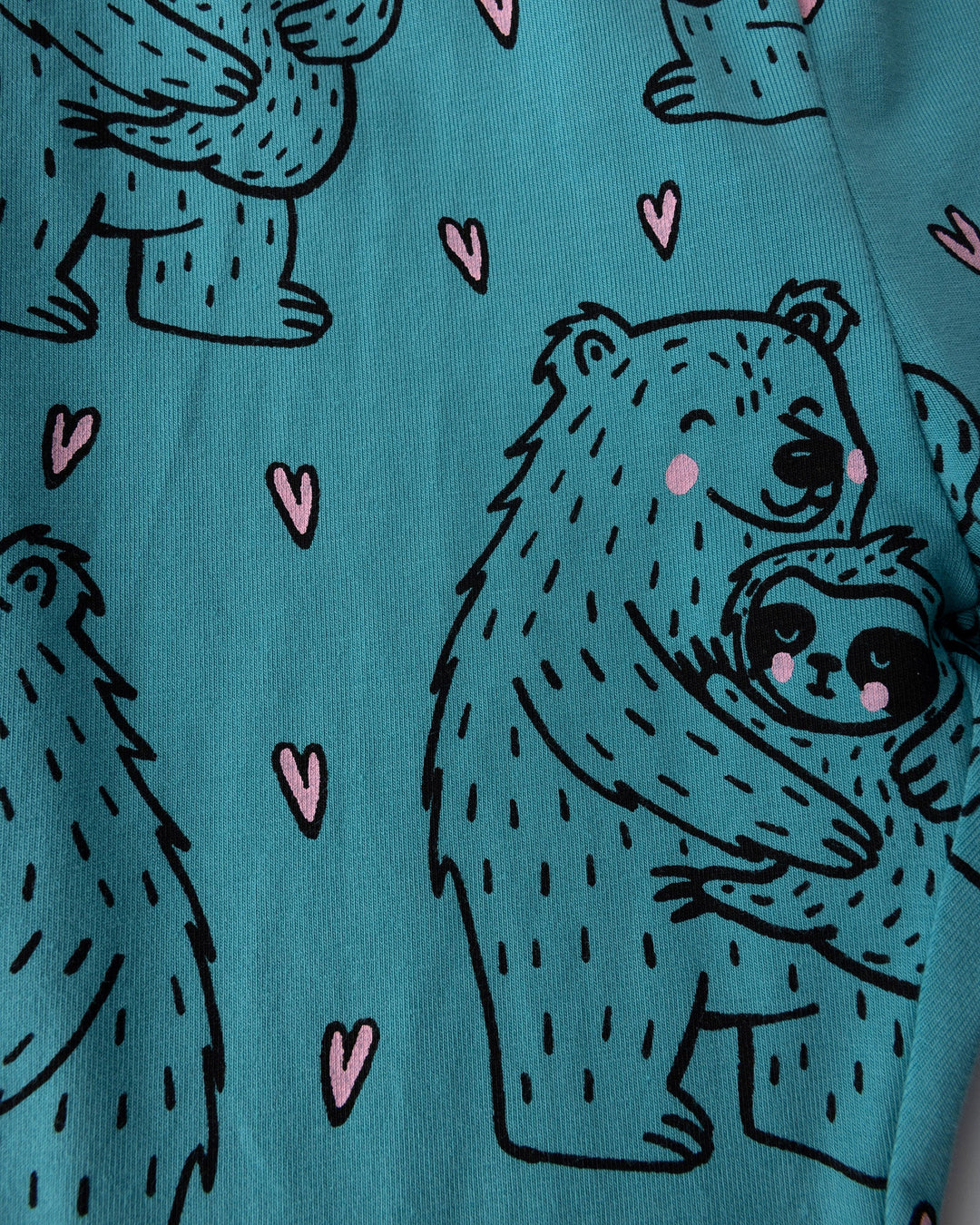 Close up of the Bear Hug Bike Pant print in emerald