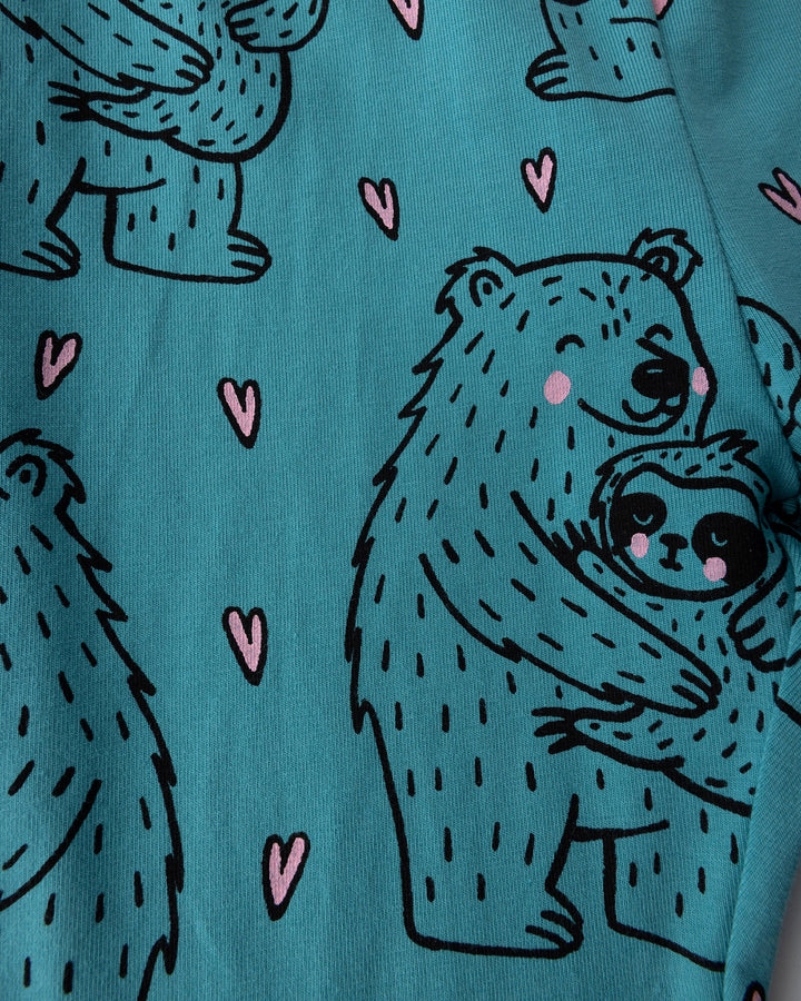 Close up of the Bear Hug Bike Pant print in emerald