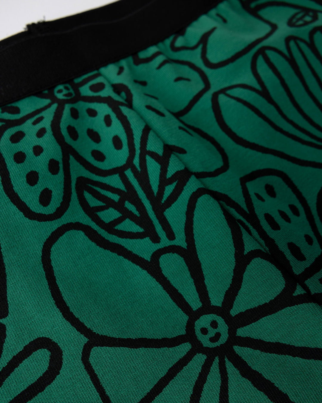 Close up detail of the Big Flowers Bike Pant in kelly green