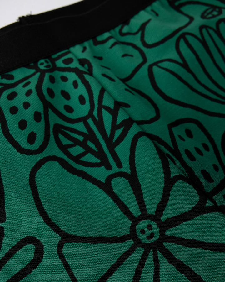 Close up detail of the Big Flowers Bike Pant in kelly green