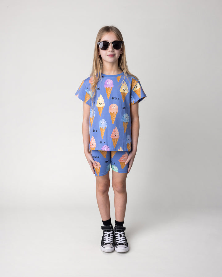 Kid wearing the Happy Icecreams Bike Pant in cornflower with the Happy Icecreams Tee in cornflower, front view
