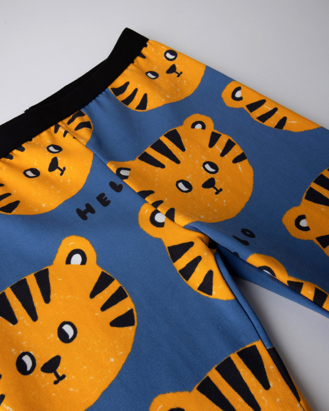 Close up of the Hello Tiger Bike Pant print in blue