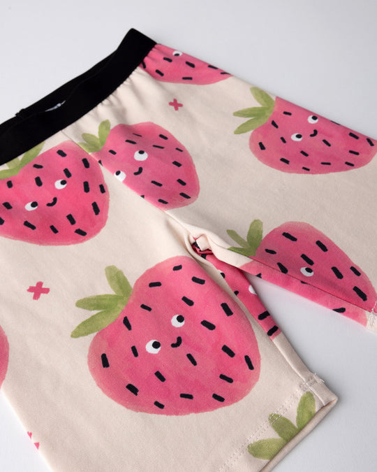 Close up of the Happy Strawberry Bike Pant print in cream
