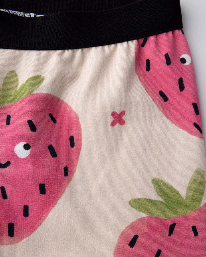 Close up of the Happy Strawberry Bike Pant print in cream
