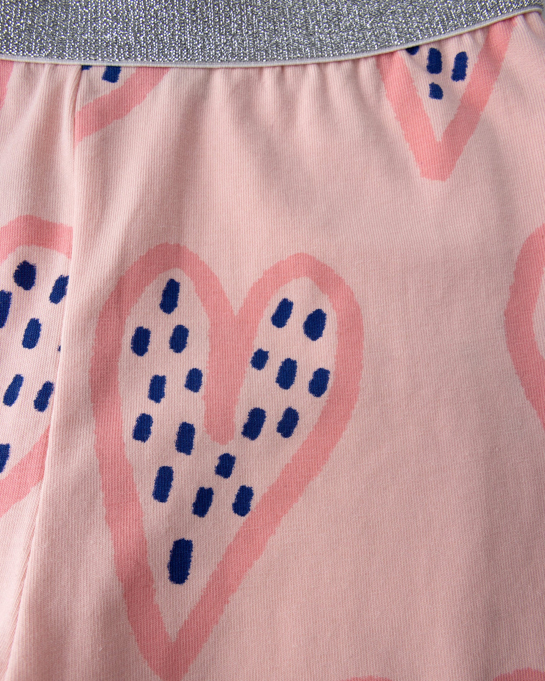 Close up detail of the Speckle Heart Bike Pant in pink