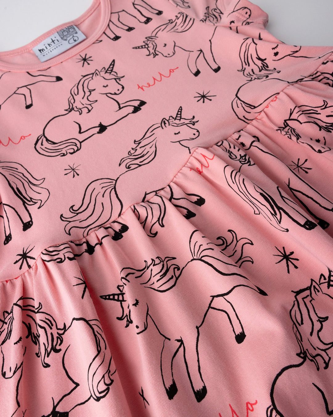 Close up detail of the Hello Unicorns Dress in pink