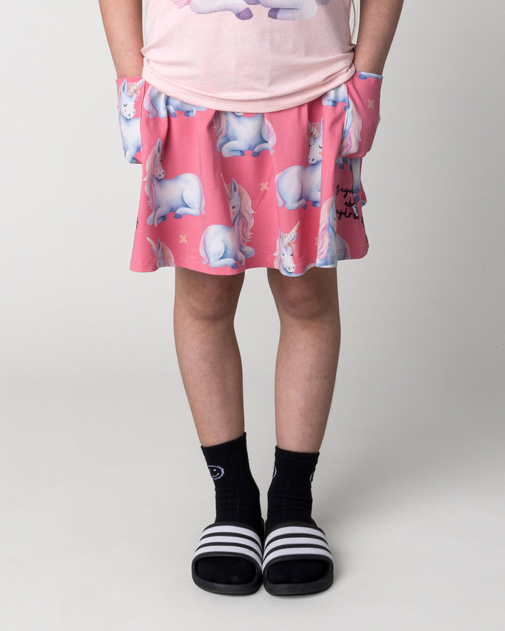 Kid wearing the Daydreaming Unicorn Skirt in candy, front view close up