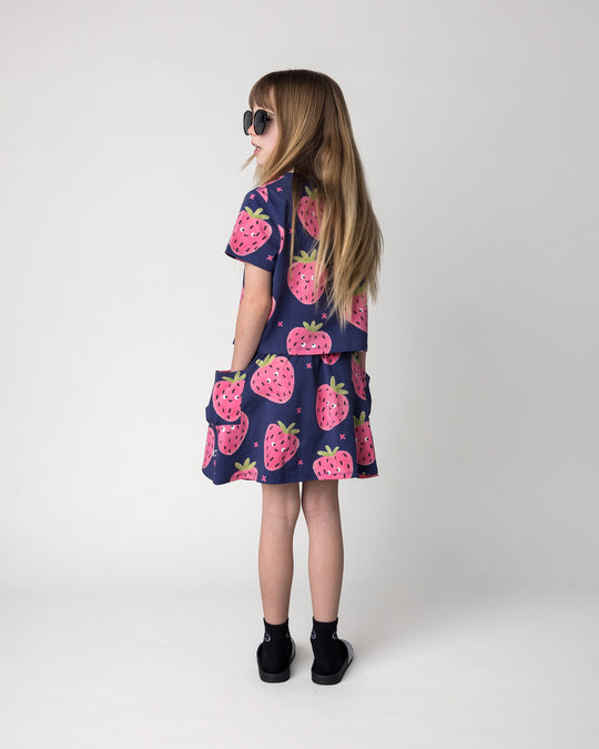 Kid wearing the Happy Strawberry Skirt in turquoise with the Happy Strawberry Cropped Tee in turquoise, back view