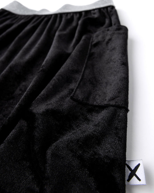 Close up detail of the Velvet Skirt in black