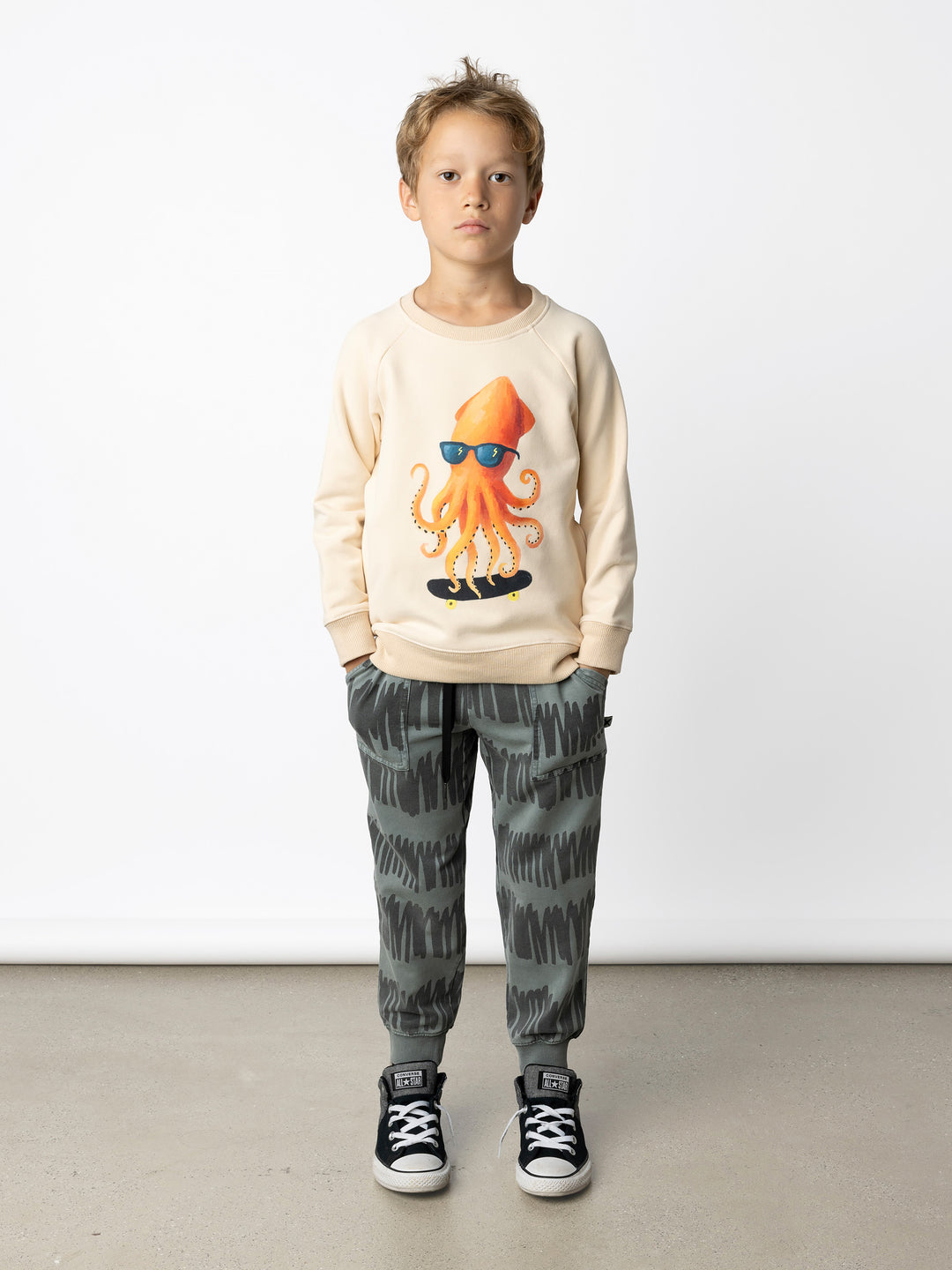 Minti kids clothing. Super cool and comfy crew with hidden side pockets. Perfect for keeping hands warm! 330 Gram // Brushed Inside // 95% Cotton // 5% Elastane.