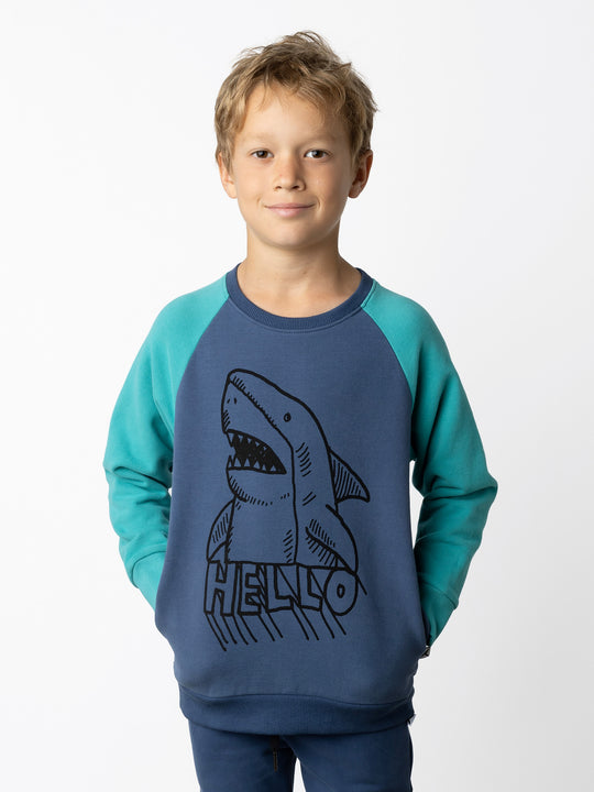 Minti kids clothing. Super cool and comfy crew with hidden side pockets. Perfect for keeping hands warm! 330 Gram // Brushed Inside // 95% Cotton // 5% Elastane.
