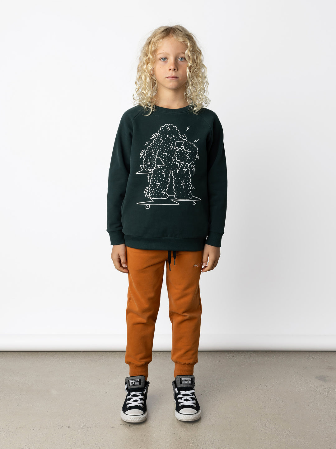 Minti kids clothing. Super cool and comfy crew with hidden side pockets. Perfect for keeping hands warm! 330 Gram // Brushed Inside // 95% Cotton // 5% Elastane.