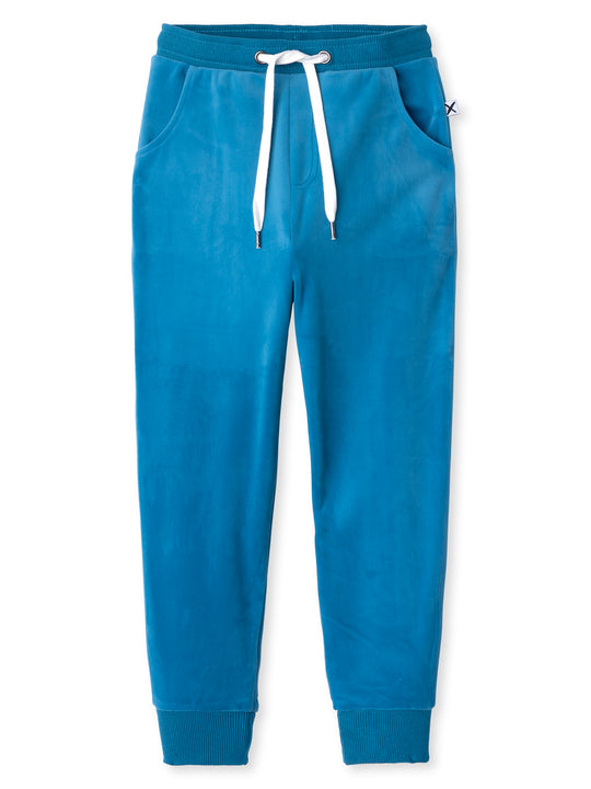Minti kids clothing. Slim leg trackies with front pockets, elasticated waistband and shoelace cord. 92% Polyester // 8% Spandex.