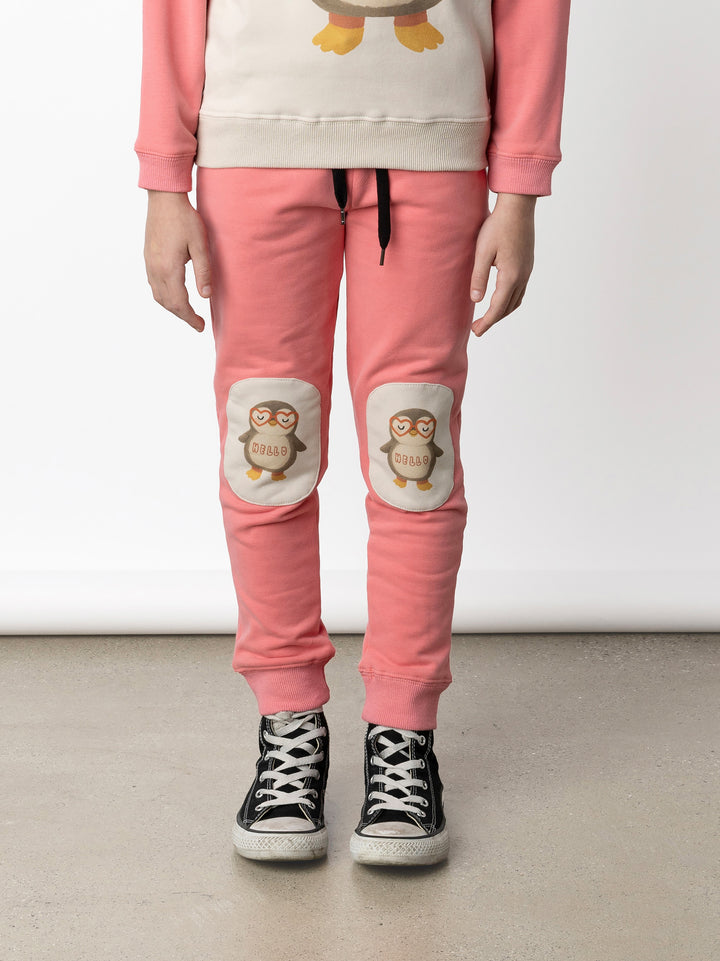 Minti kids clothing. Slim leg trackies with front pockets, shoelace cord and 2x2 rib waistband and cuffs. We recommend to go up a size for this style. 330 Gram // Brushed Inside // 95% Cotton // 5% Elastane.