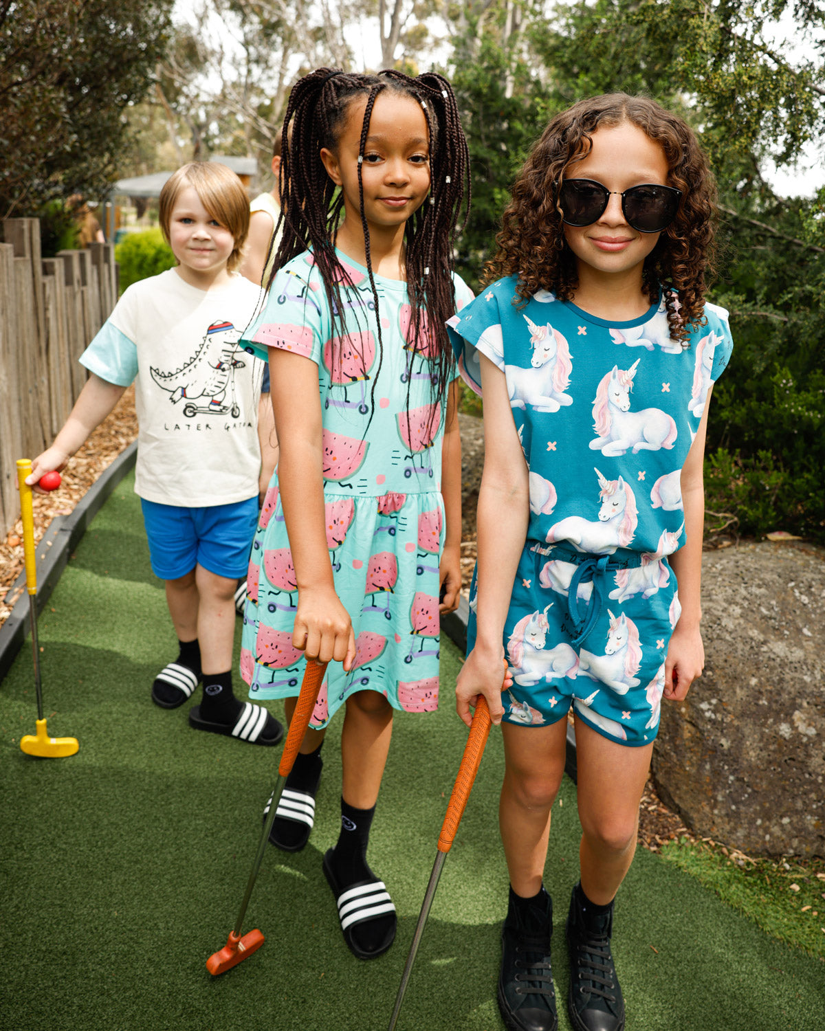 Kids in Minti Later Gator, Scooting Watermelon and Daydreaming Unicorn at mini golf