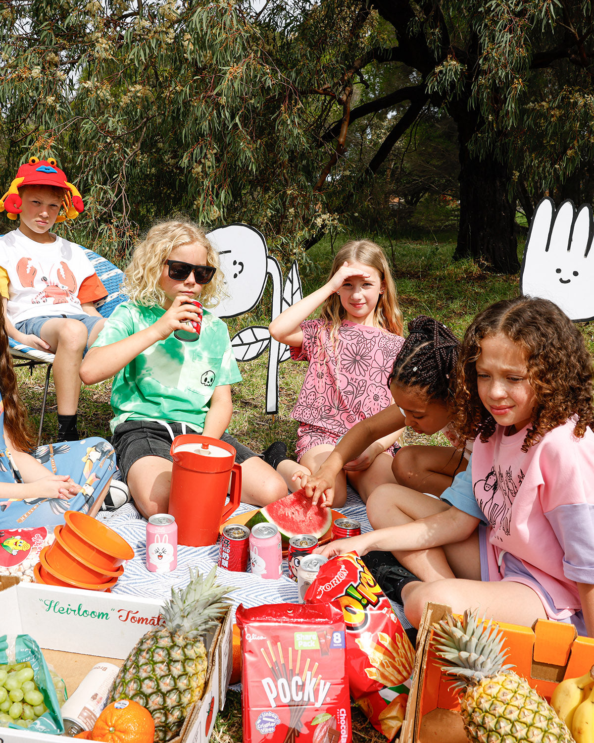 Kids at a picnic in Minti Vacay Crayfish, Big Flowers and Unicorn Club