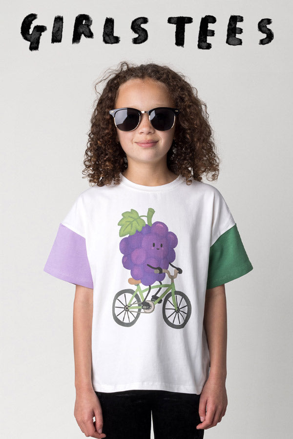 Shop girls tees at Minti, kid wearing the Biking Grape Tee in white