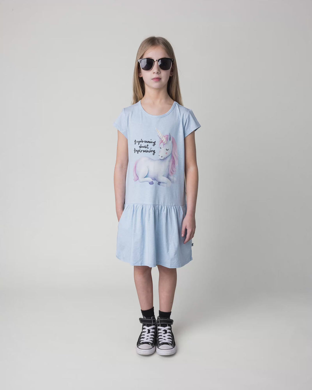 Kid wearing the Daydreaming Unicorn Dress in light blue marle, full circle video
