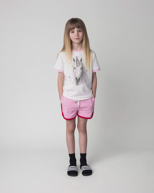 Kid wearing the Watercolour Unicorn Tee in white and pink, full circle video