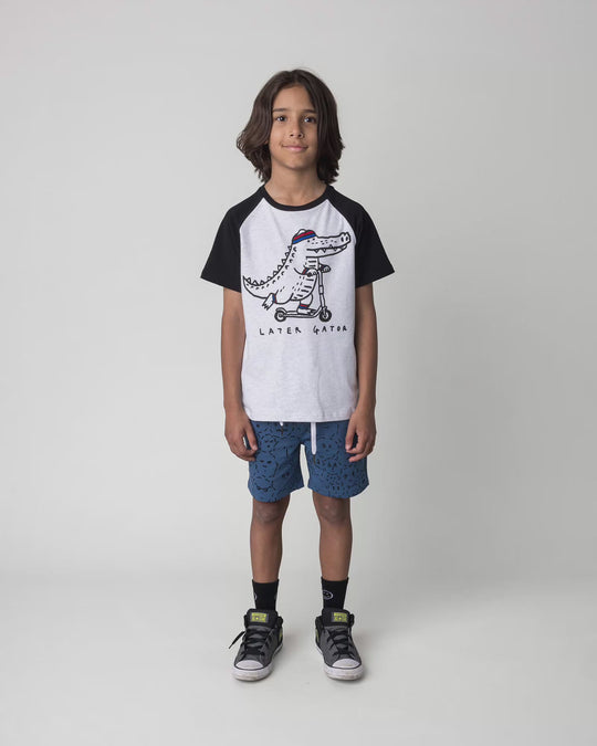 Kid wearing the Later Gator Tee in white marle and black, full circle video
