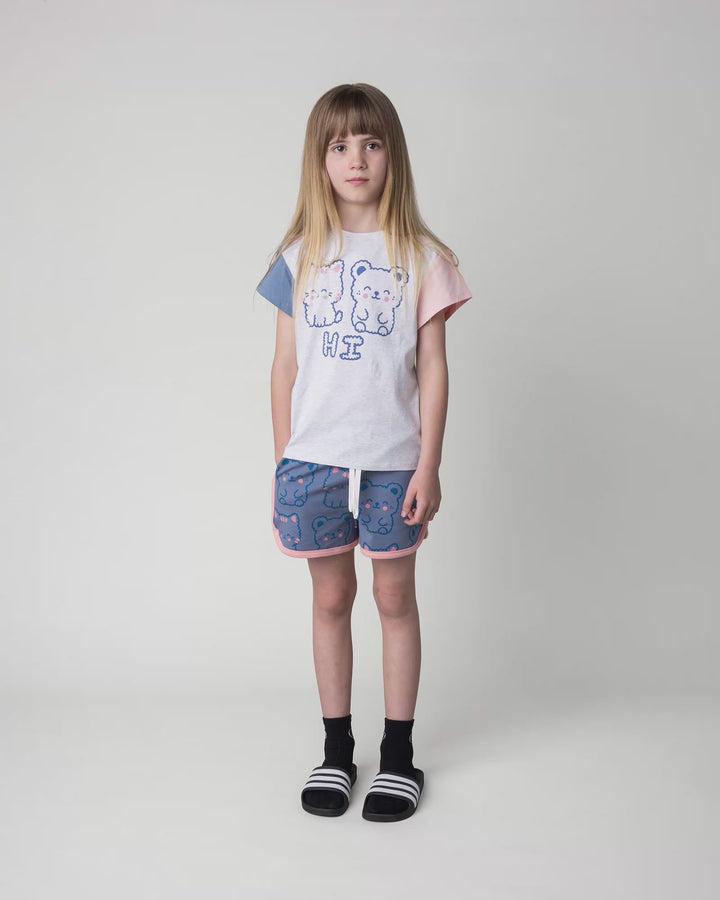 Kid wearing the Hi Cat Bear Tee in white marle, full circle video
