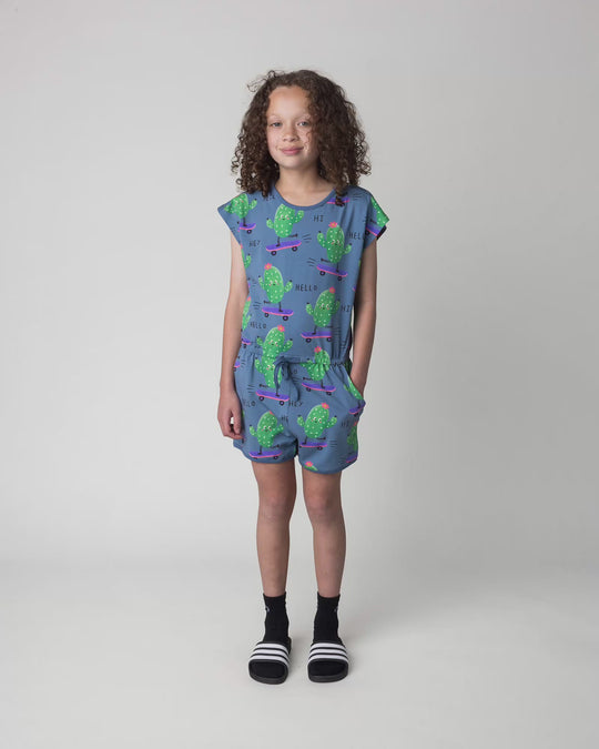 Kid wearing the Skate Cactus Playsuit in muted blue, full circle video