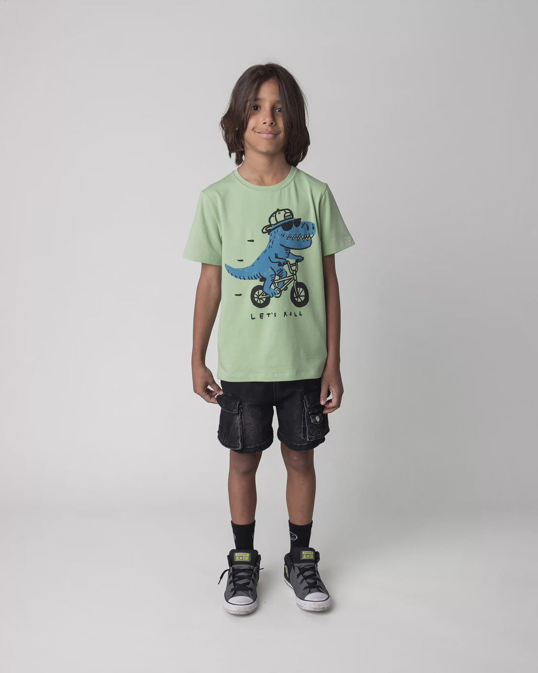 Kid wearing the Rex Rider Tee in sage, full circle video