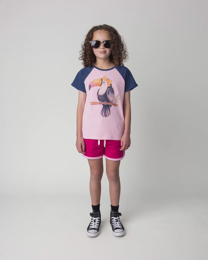 Kid wearing the Hello Toucan Tee in ballet and ink, full circle video