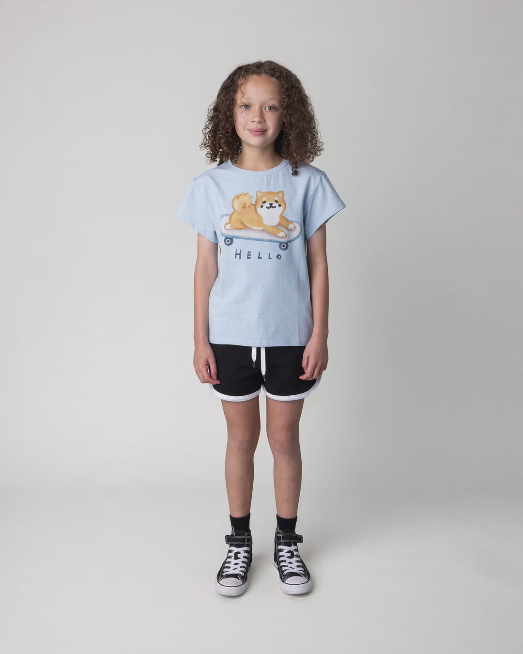 Kid wearing the Skate Puppy Tee in light blue marle, full circle video
