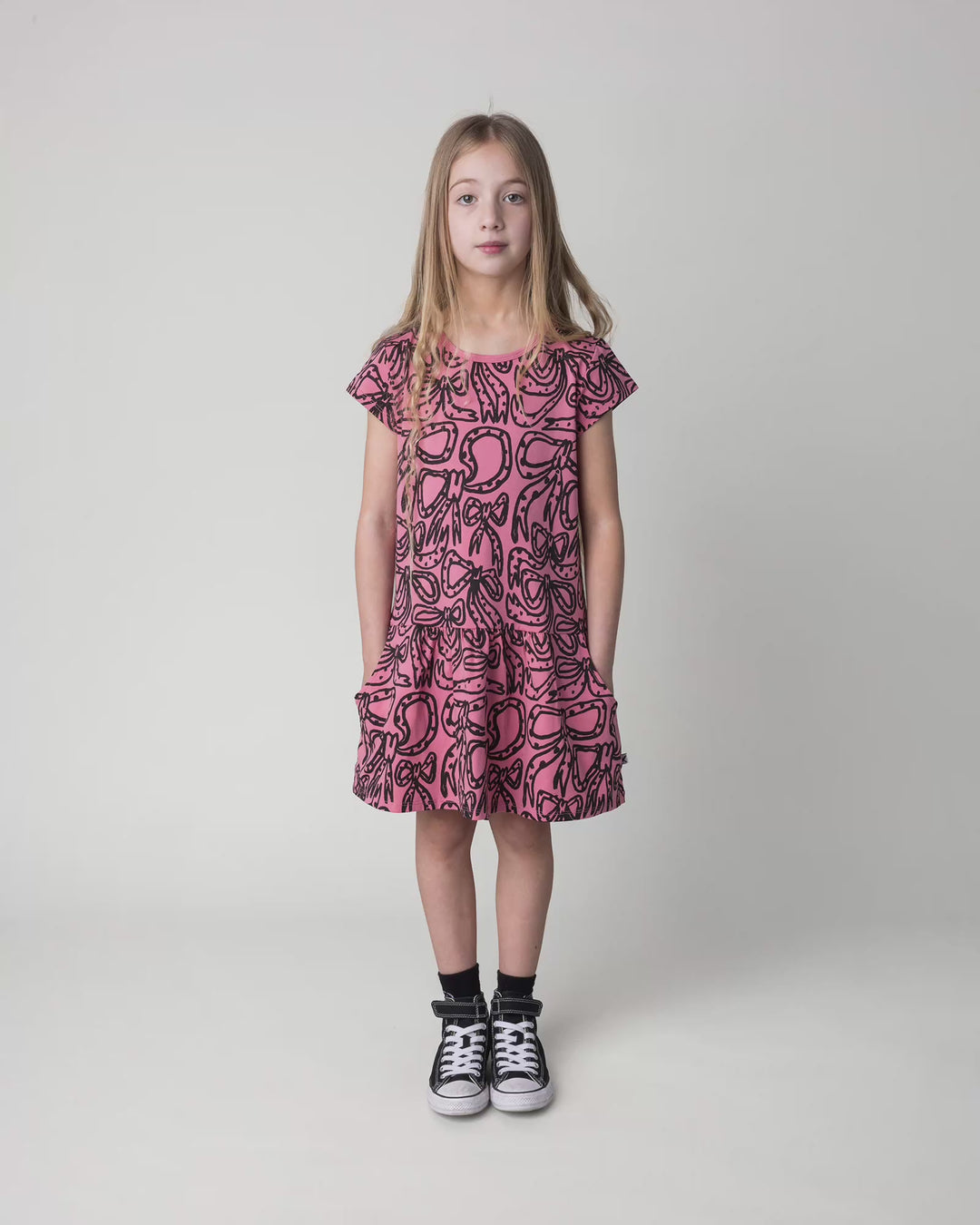 Kid wearing the Big Bows Dress in candy, full circle video