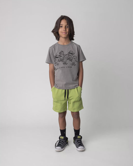 Kid wearing the Track Short in lime, full circle video