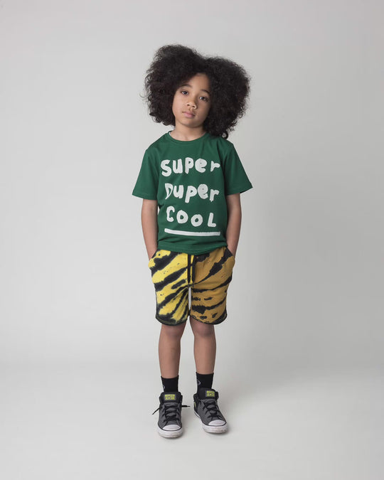 Kid wearing the Super Duper Cool Tee in jungle, full circle video