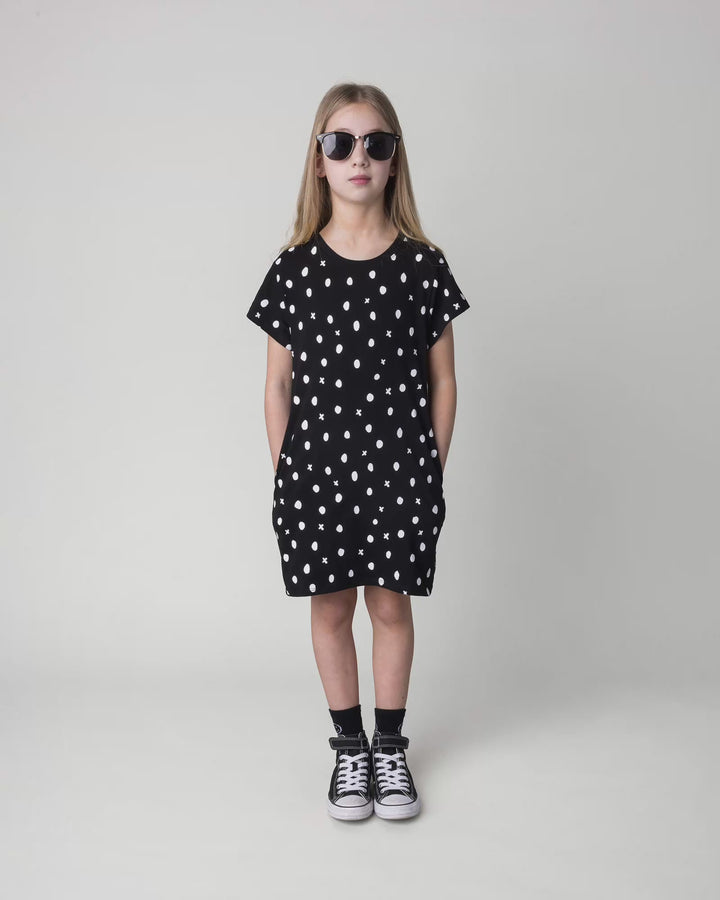 Kid wearing the Spotty Dress in black, full circle video