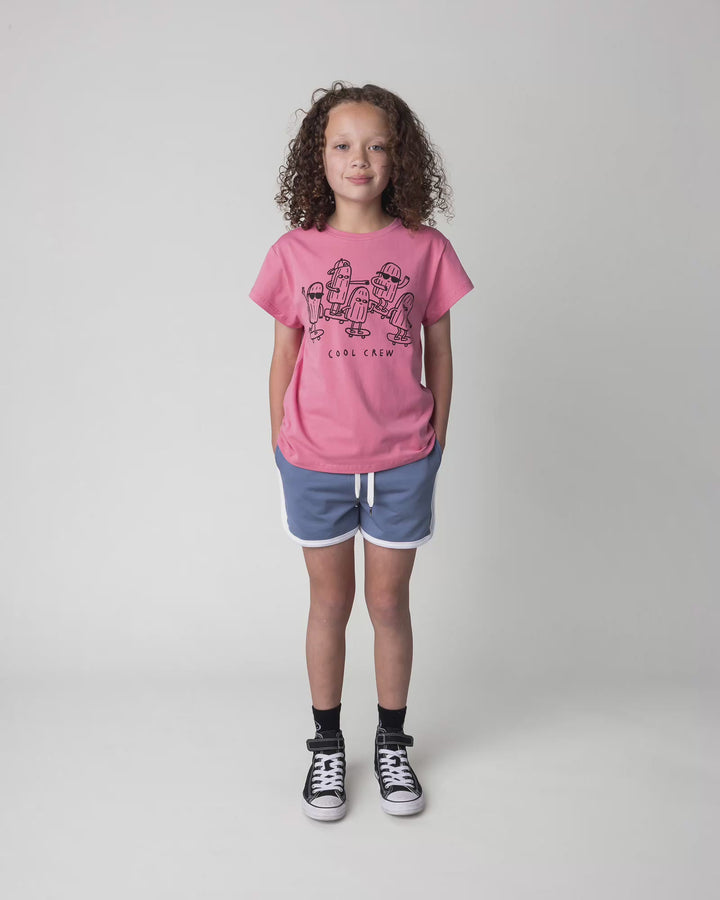 Kid wearing the Cool Crew Tee in candy, full circle video