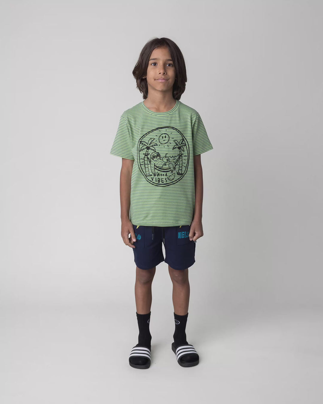 Kid wearing the Badges Short in ink, full circle video