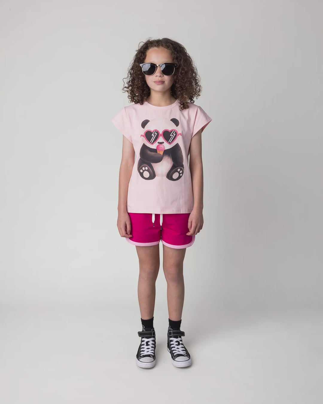 Kid wearing the Icecream Panda Tee in light pink, full circle video