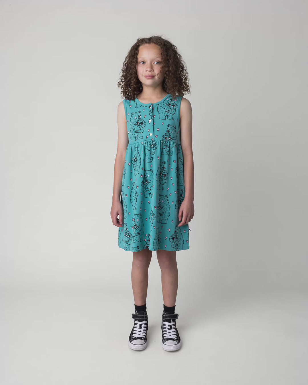 Kid wearing the Bear Hug Dress in emerald, full circle video