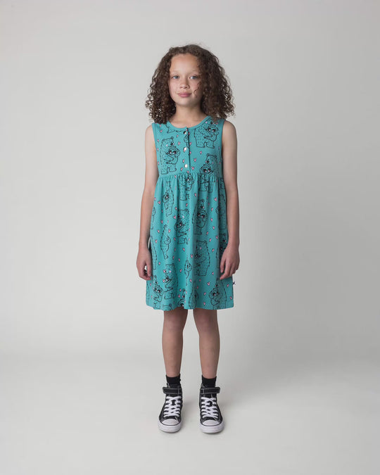 Kid wearing the Bear Hug Dress in emerald, full circle video